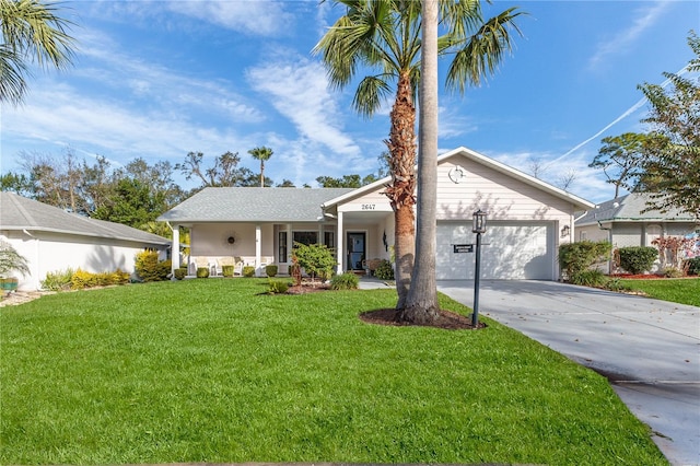 view of front of property with a garage and a front lawn