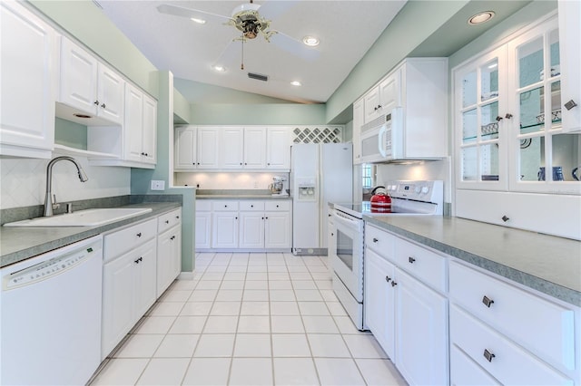 kitchen with ceiling fan, sink, lofted ceiling, white appliances, and white cabinets