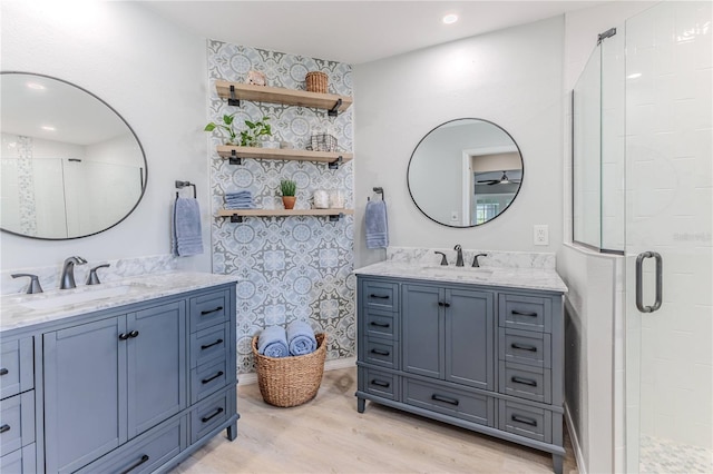 bathroom with vanity, wood-type flooring, and walk in shower