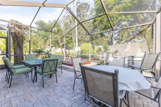 view of patio with glass enclosure