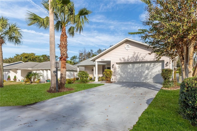 ranch-style house with a garage and a front yard