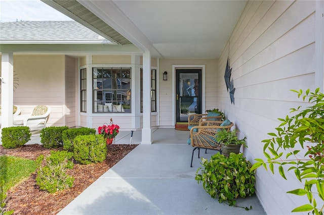 entrance to property featuring covered porch