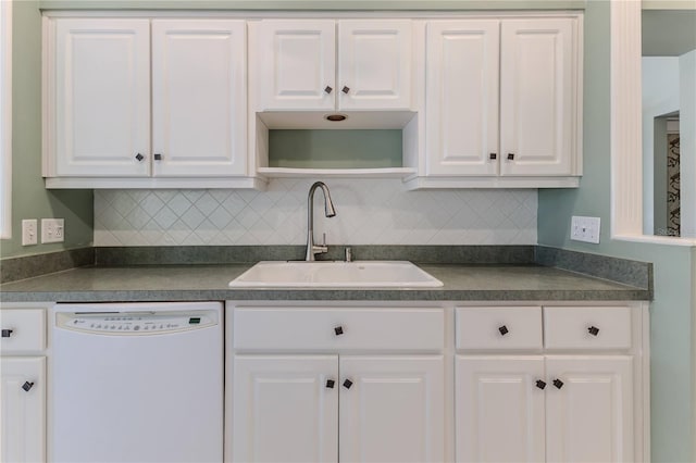 kitchen featuring white dishwasher, white cabinetry, and sink