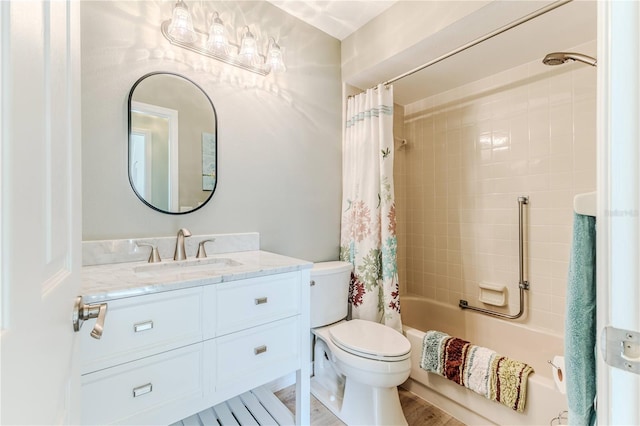 full bathroom featuring hardwood / wood-style floors, vanity, toilet, and shower / bath combo with shower curtain