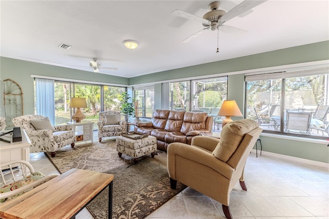 sunroom / solarium featuring ceiling fan