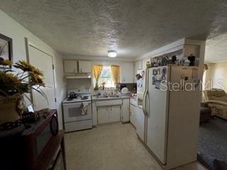 kitchen with white cabinetry, white appliances, and a textured ceiling