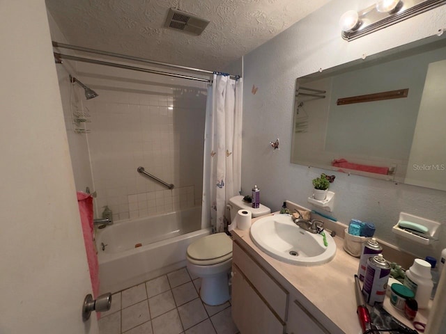 full bathroom with shower / bath combo, vanity, tile patterned flooring, toilet, and a textured ceiling