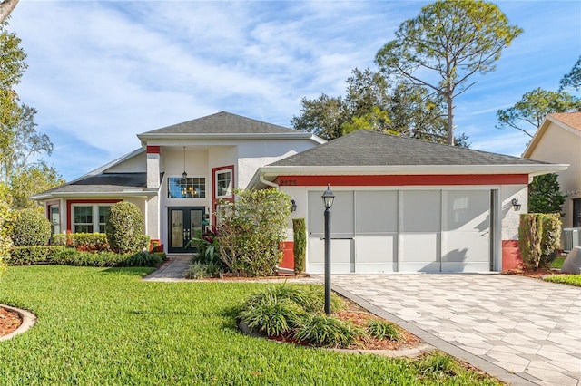 view of front of home with a front lawn and french doors