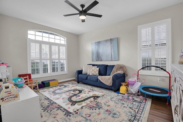 interior space featuring wood-type flooring and ceiling fan