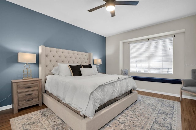 bedroom featuring hardwood / wood-style floors and ceiling fan