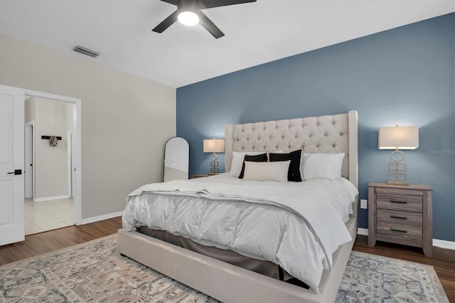 bedroom featuring hardwood / wood-style flooring and ceiling fan