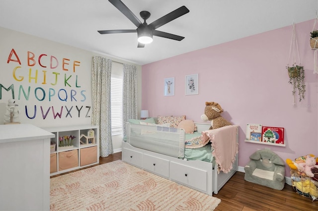 bedroom with hardwood / wood-style floors and ceiling fan