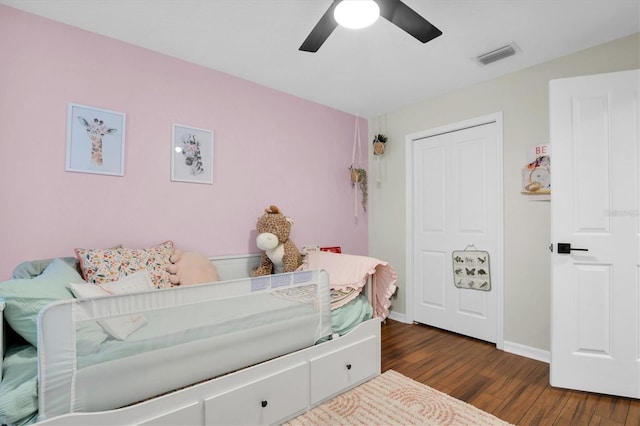 bedroom featuring ceiling fan and dark wood-type flooring