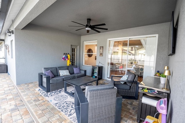 view of patio with outdoor lounge area and ceiling fan