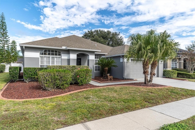 single story home with a front yard and a garage