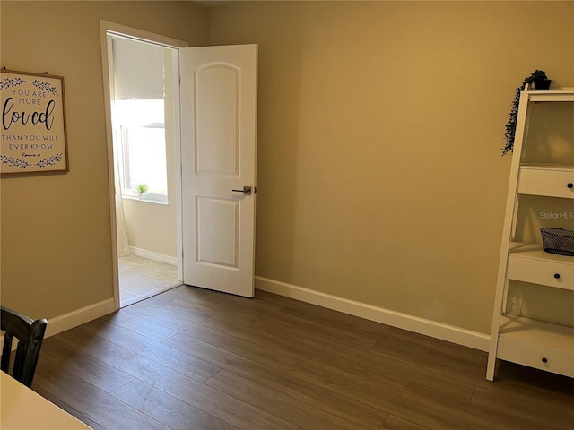 unfurnished room featuring hardwood / wood-style flooring