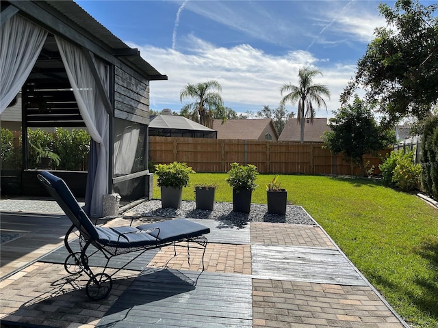 deck featuring a yard and a patio area