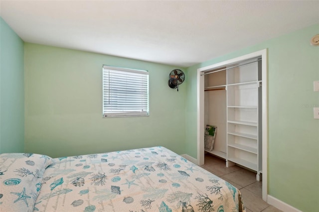 bedroom featuring a closet and light tile patterned floors