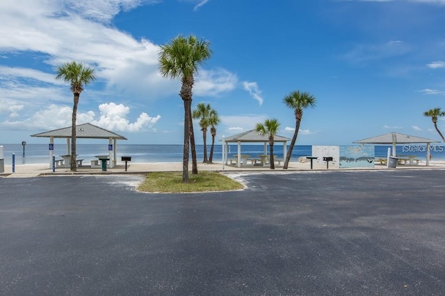 property view of water with a beach view and a gazebo