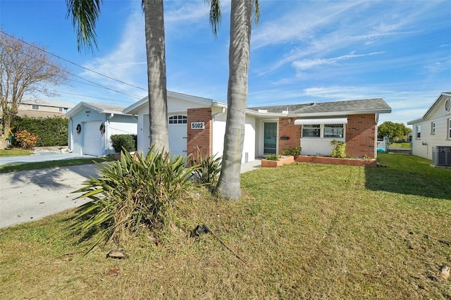 single story home with central AC unit, a garage, and a front lawn