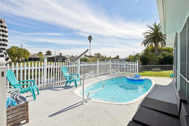 view of swimming pool with a patio