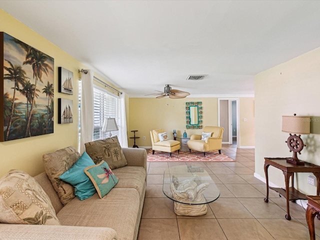 tiled living room with ceiling fan