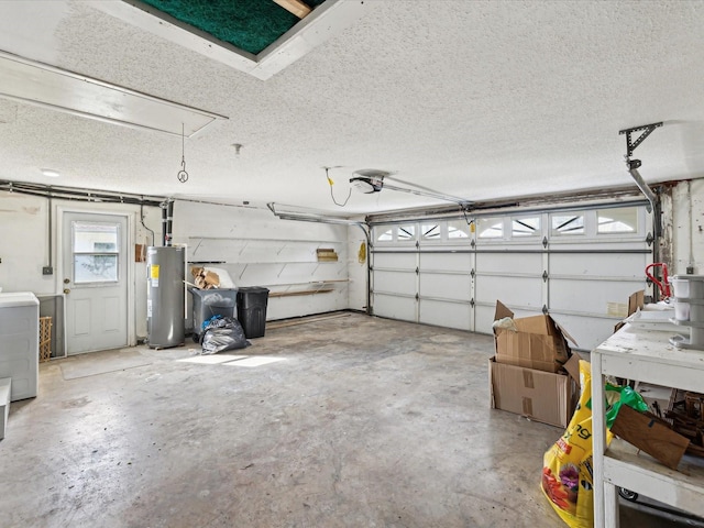 garage featuring washer / clothes dryer, water heater, and a garage door opener