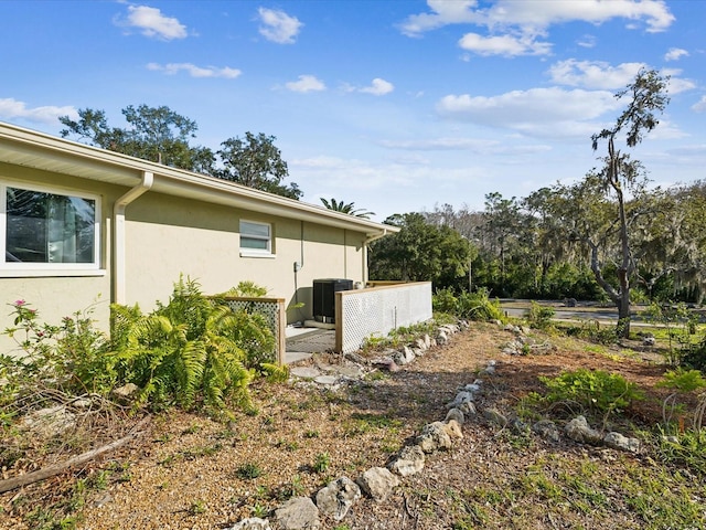 view of home's exterior with central AC unit