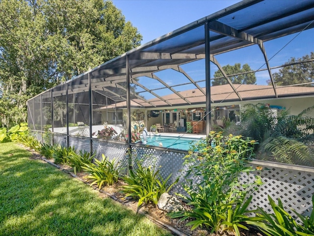 view of pool featuring a lanai