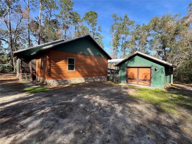 view of property exterior featuring an outbuilding