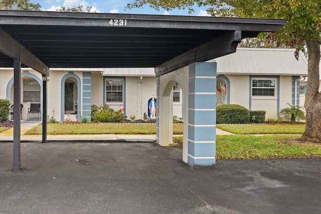 exterior space with a carport