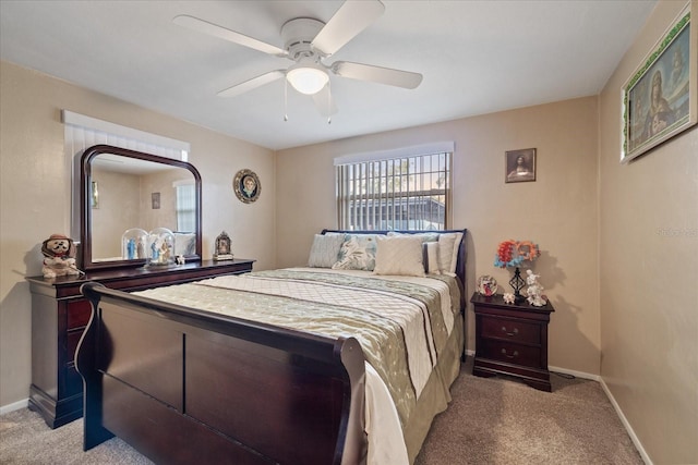 bedroom featuring ceiling fan and carpet