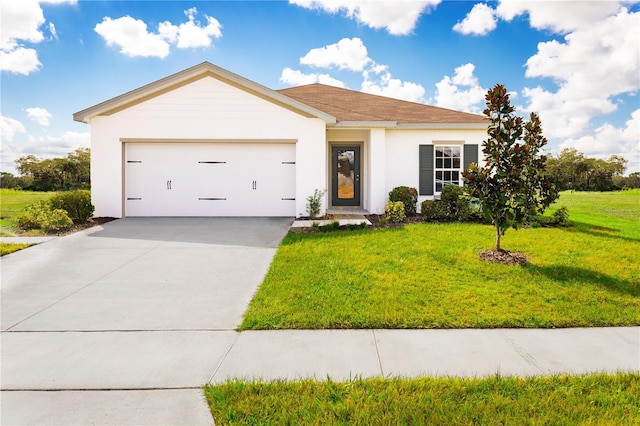 view of front of home with a front lawn and a garage