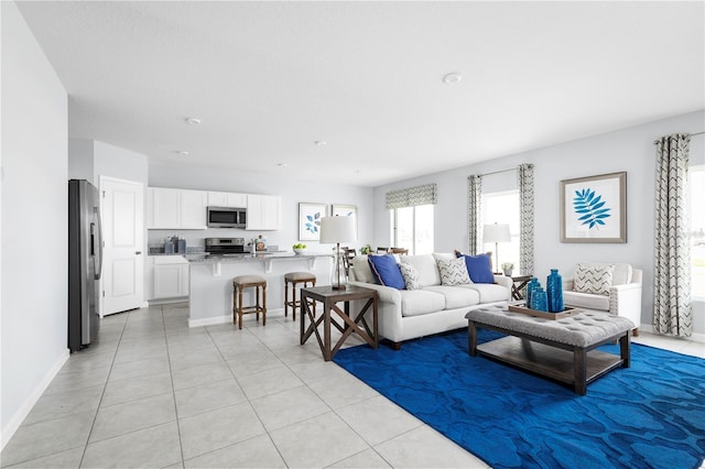 living room with light tile patterned flooring