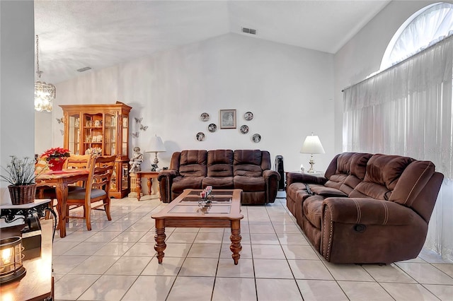 tiled living room featuring lofted ceiling