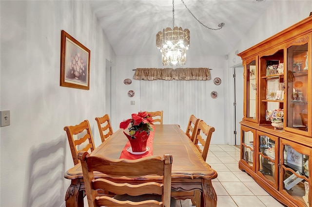 tiled dining space featuring an inviting chandelier