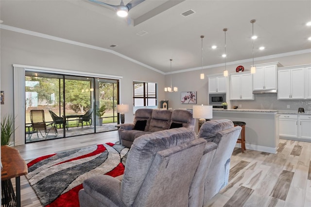 living room with lofted ceiling, ceiling fan with notable chandelier, light hardwood / wood-style flooring, and crown molding