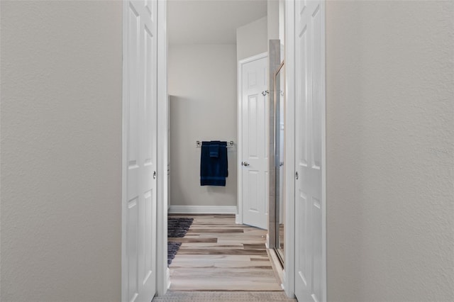 hallway featuring light wood-type flooring