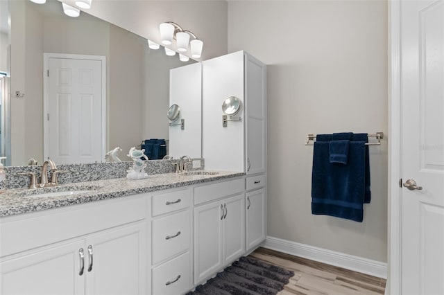 bathroom featuring hardwood / wood-style floors and vanity