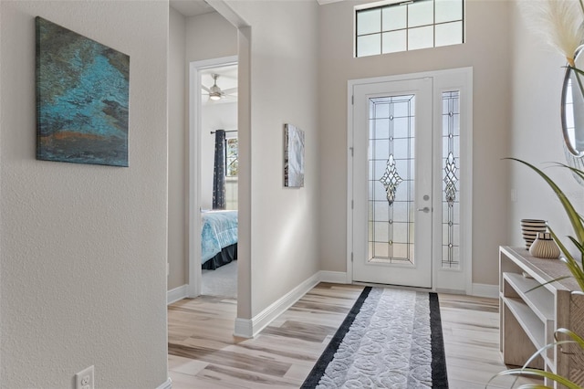 foyer featuring ceiling fan and light hardwood / wood-style floors