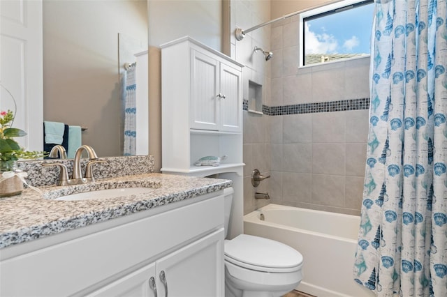 full bathroom with vanity, shower / bath combination with curtain, and toilet