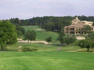 view of property's community featuring a lawn