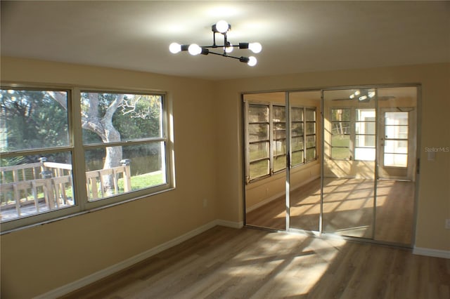 interior space featuring a chandelier and hardwood / wood-style flooring