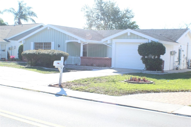 ranch-style house with a front lawn and a garage