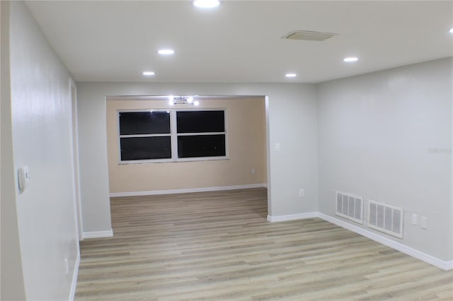 unfurnished room with light hardwood / wood-style flooring