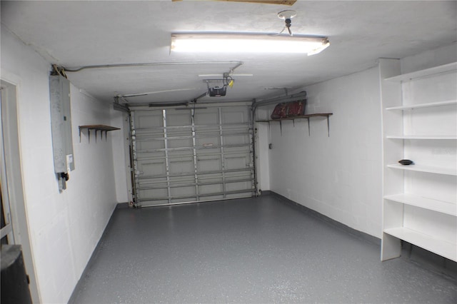 garage featuring a garage door opener and electric panel