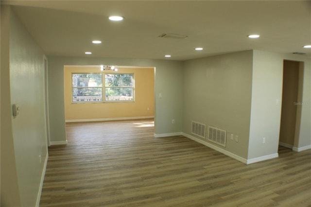 spare room with hardwood / wood-style flooring