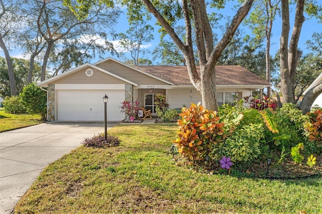 ranch-style house featuring a garage and a front yard