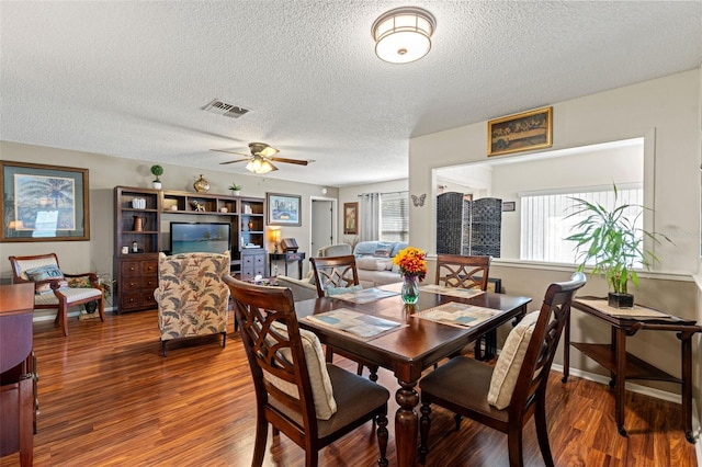 dining space featuring hardwood / wood-style floors, ceiling fan, and a wealth of natural light