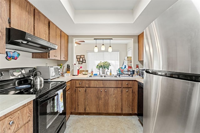 kitchen with black appliances, ventilation hood, sink, ceiling fan, and decorative light fixtures